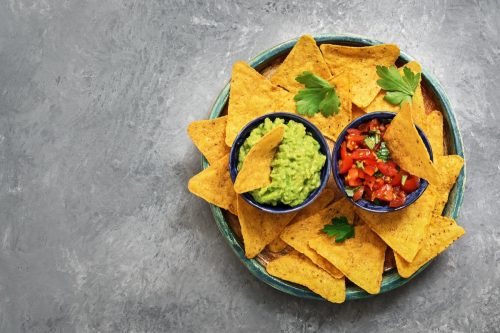 tortilla chips with salsa and guacamole in a bowl