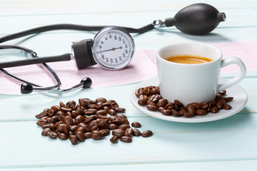 Coffee cup, coffee beans, and blood pressure cuff