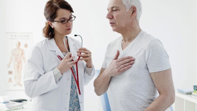 female doctor consulting male patient on heart concern