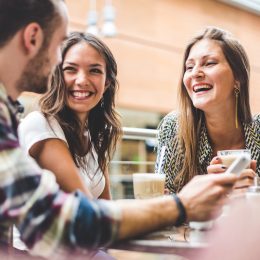 friends laughing around a table