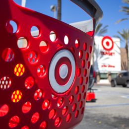 A shopping cart is parked in front of the Target department store