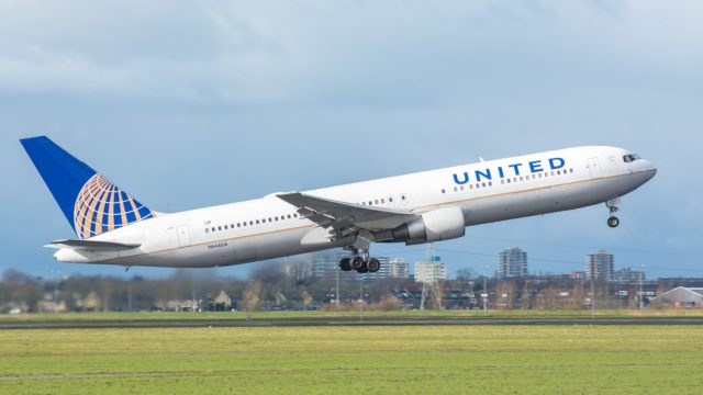 A United Airlines plane taking off from an airport