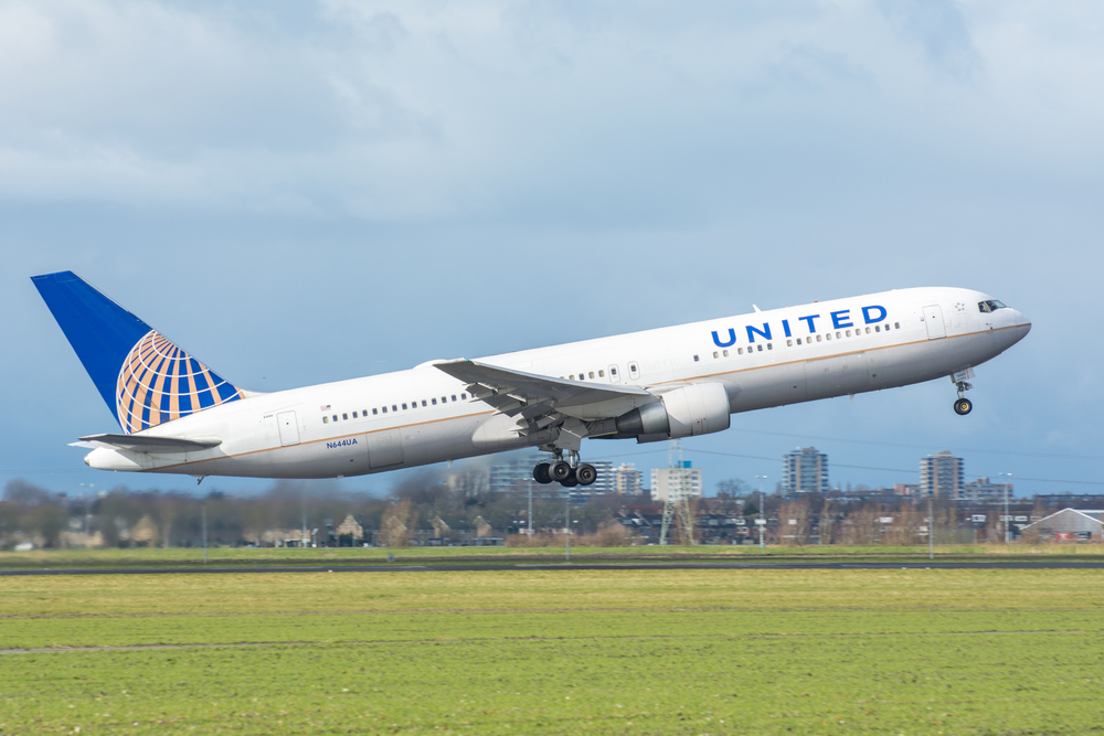 A United Airlines plane taking off from an airport