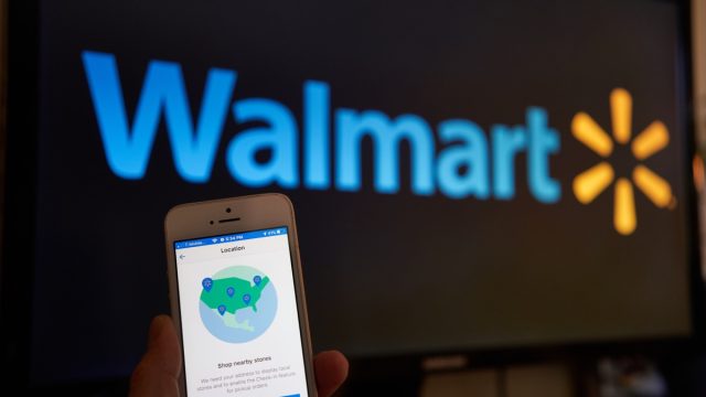 A man using Walmart Grocery Shopping mobile app and trying to find the nearest store from his smartphone.