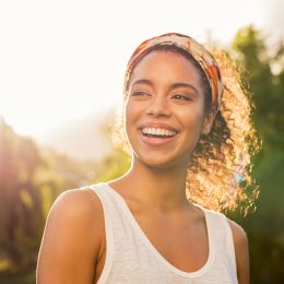 woman smiling at sunset