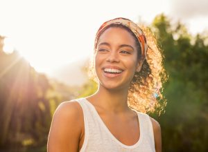 woman smiling at sunset