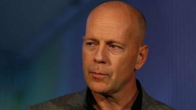 A closeup of Bruce Willis during a premier