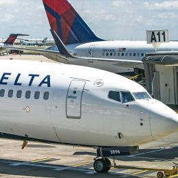 Delta Airlines passenger jet arrives at a gate at Hartsfield-Jackson Atlanta International Airport.