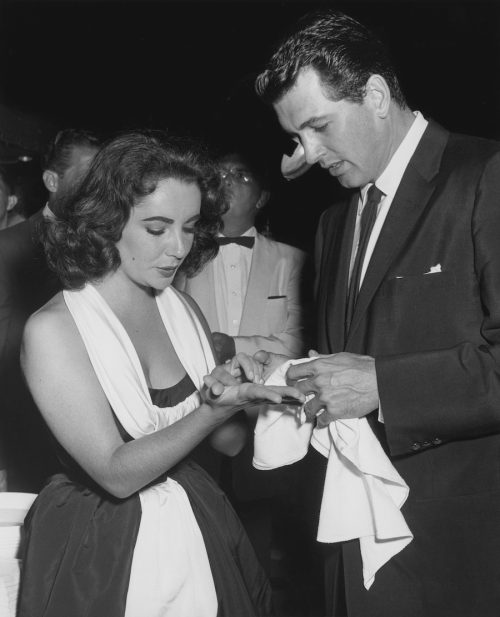 Elizabeth Taylor and Rock Hudson at a handprint and footprint ceremony at Grauman's Chinese Theatre in 1956