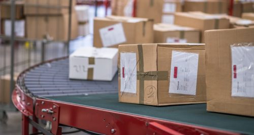 Cardboard boxes package on conveyor belt