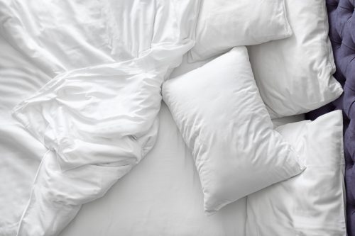 bedsheets and pillows on bed