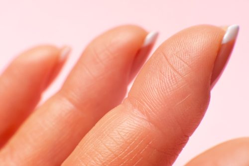 close up of fingertips with long nails