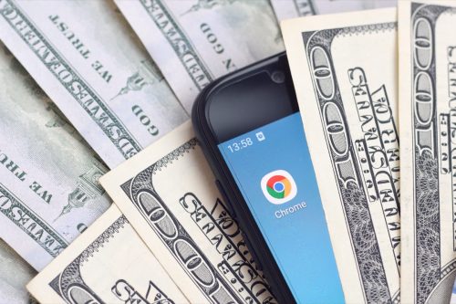 smartphone screen with google chrome app and money