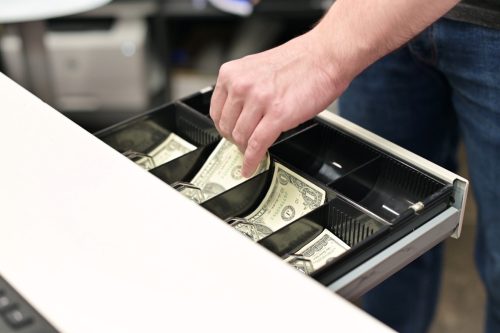 cashier opening drawer for cash