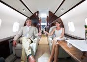 wealthy couple on jet