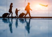 Silhouette of young family and airplane
