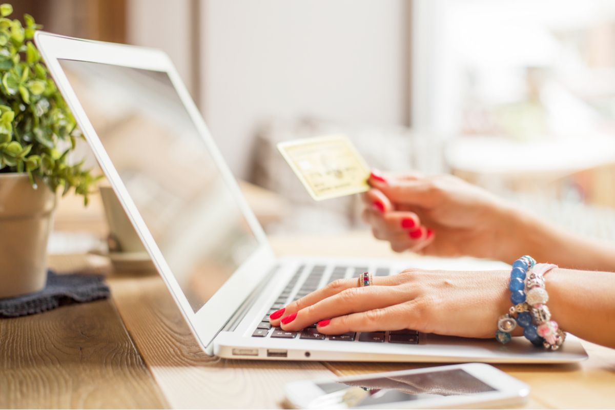 Woman with computer shopping online