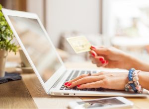 Woman with computer shopping online