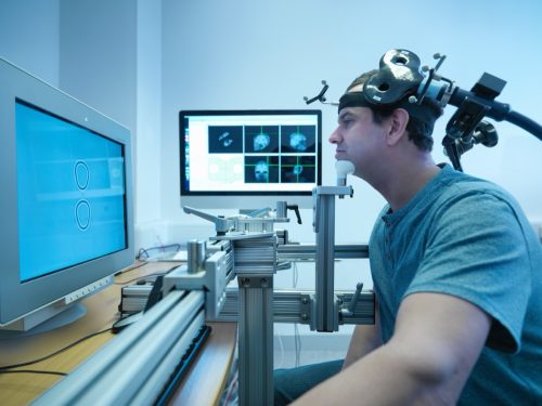 Man in transcranial magnetic stimulation (TMS) experiment