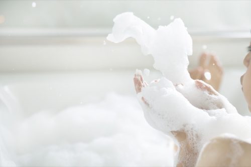 playing with bubbles in a bubble bath