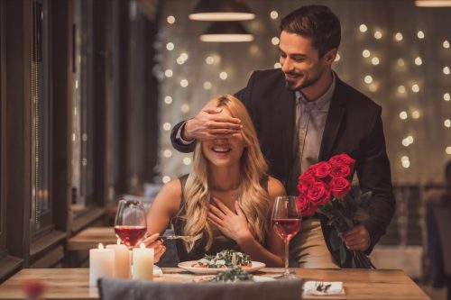 man surprising woman on date