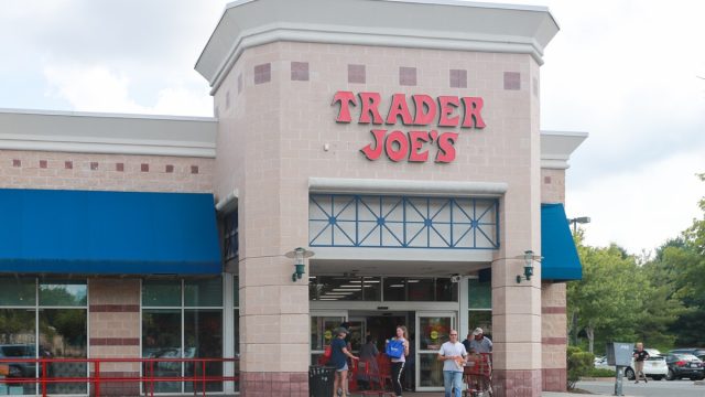 Trader Joe's exterior and sign. Trader Joe's is an American privately held chain of specialty grocery stores headquartered in Monrovia, California. - Image