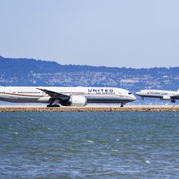 United Airlines aircraft preparing to take off and American Airlines aircraft landing at San Francisco International Airport (SFO)