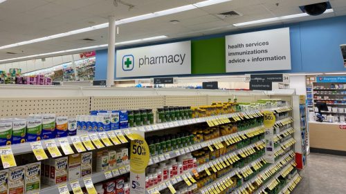 Walgreens Pharmacy offers health services, immunizations and advice in the pharmacy section of their store. View of interior pharmacy sign from a health aisle.