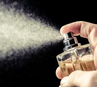 spritzing cologne or perfume