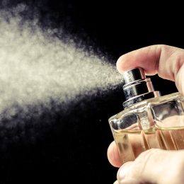 spritzing cologne or perfume