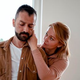 woman consoling man