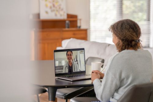 woman on telehealth appointment with doctor