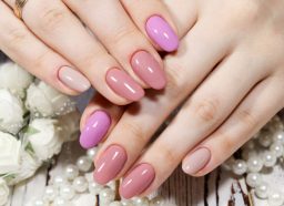 close up of perfect manicure with different pink nails