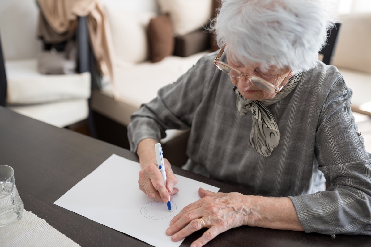 senior woman taking cognitive test for dementia