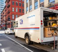 USPS truck delivering packages