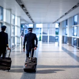 pilots walking through terminal