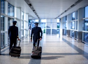pilots walking through terminal