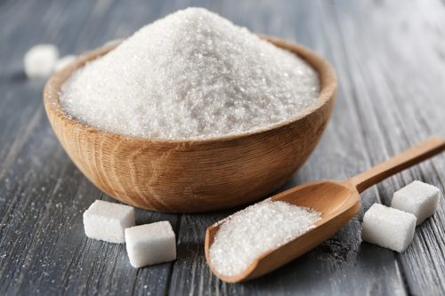 sugar in a bowl with spoon