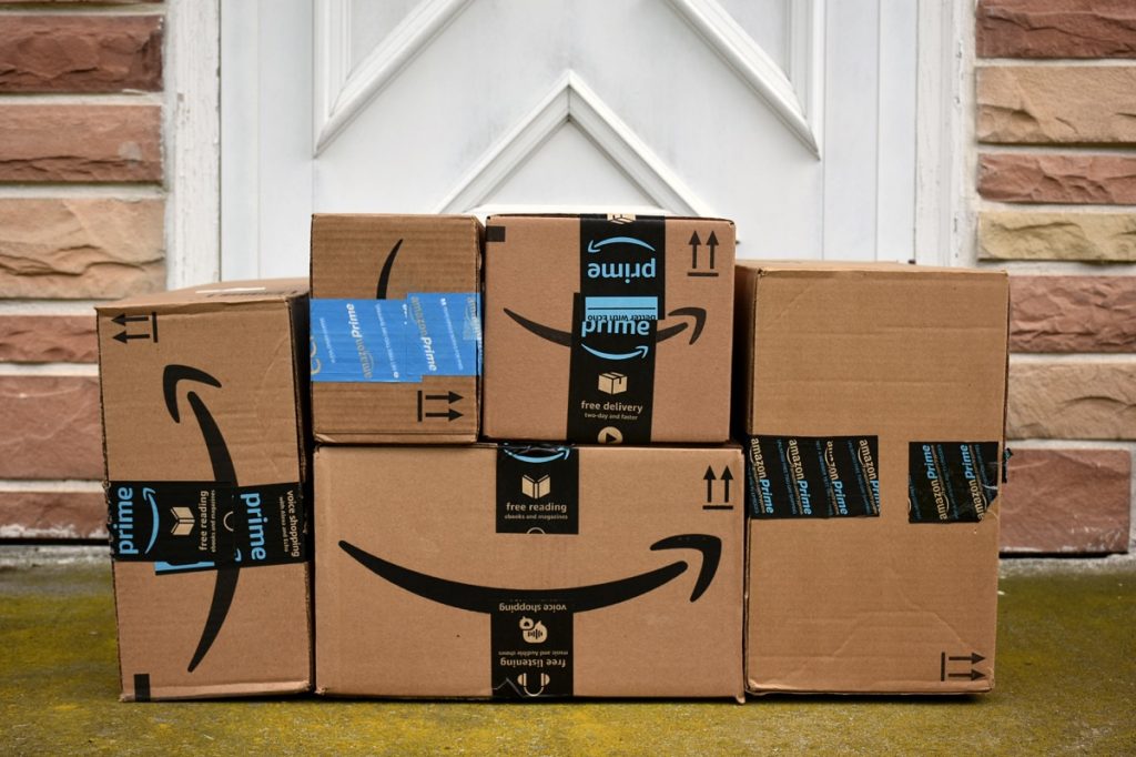Amazon packages stacked outside a front door