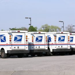 United States Postal Service mail delivery vehicles await deployment in Franklin Park, Illinois.