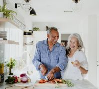 Older couple cooking together