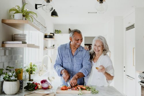 Older couple cooking together