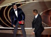 Chris Rock and Will Smith on stage at the 2022 Oscars