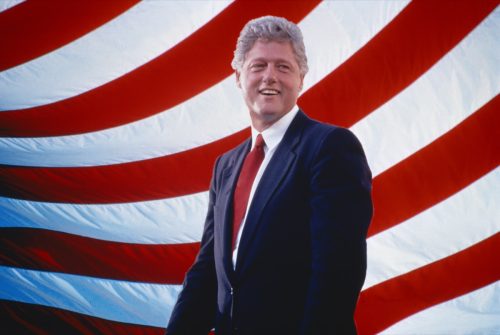 President Bill Clinton in front of American Flag