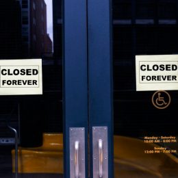 store closed with signs