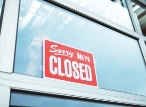 store closed sign in window