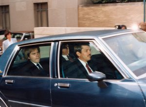 John Hinckley, Jr. in the back seat of a car outside of federal court in Washington D.C. circa 1990