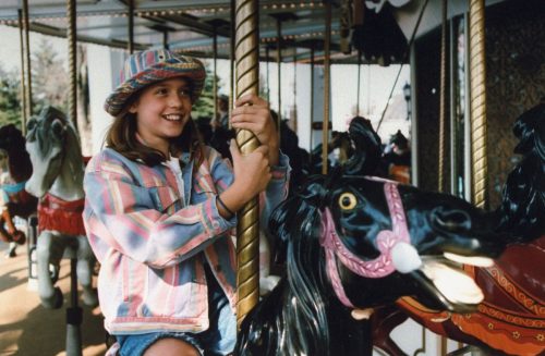 Liesel Matthews on a carousel at Six Flags Great America in