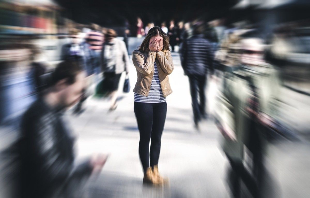 woman having a panic attack in public