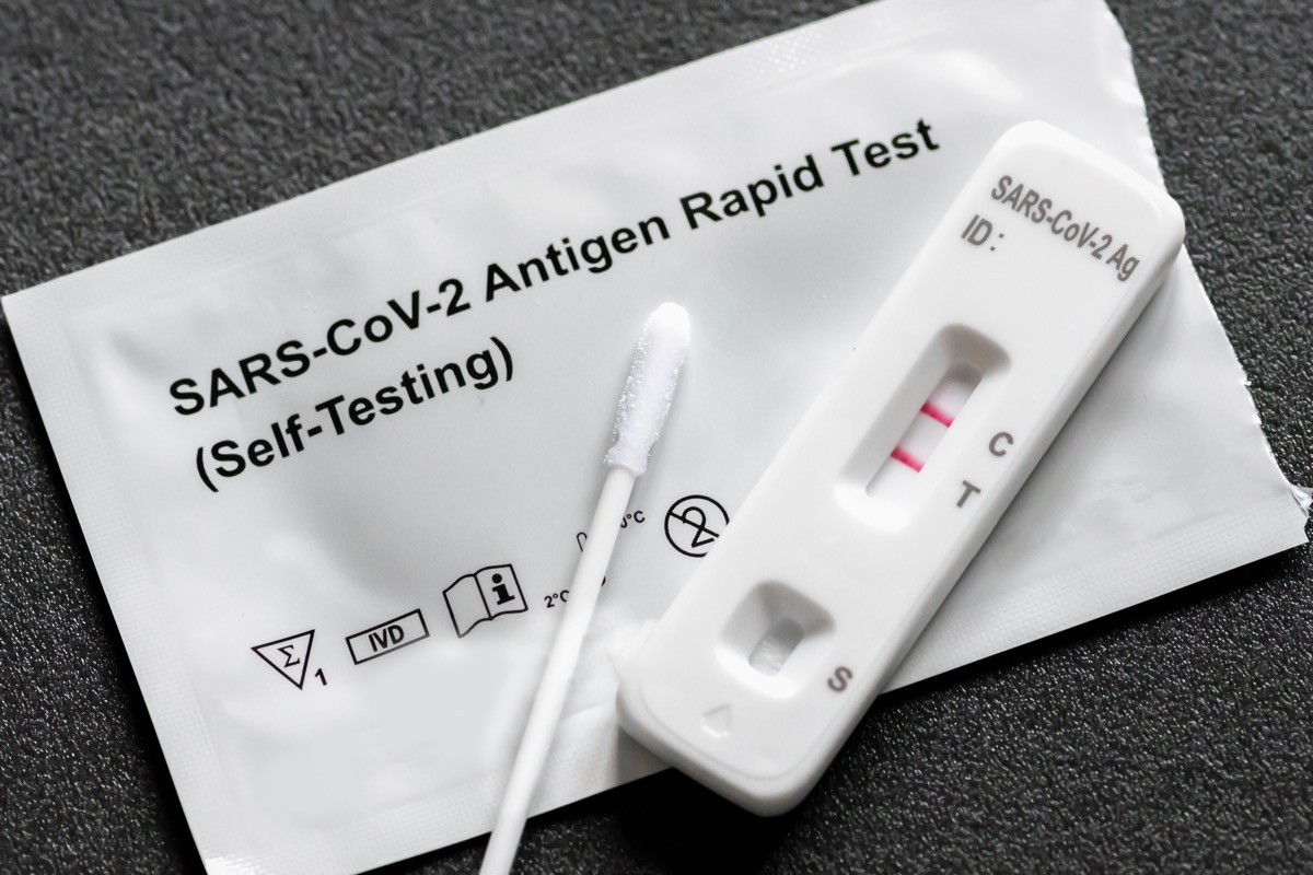 Positive Covid-19, SARS‑CoV‑2 antigen test kit for self testing, one step coronavirus antigen rapid test, saliva swab, 1 test box, close up